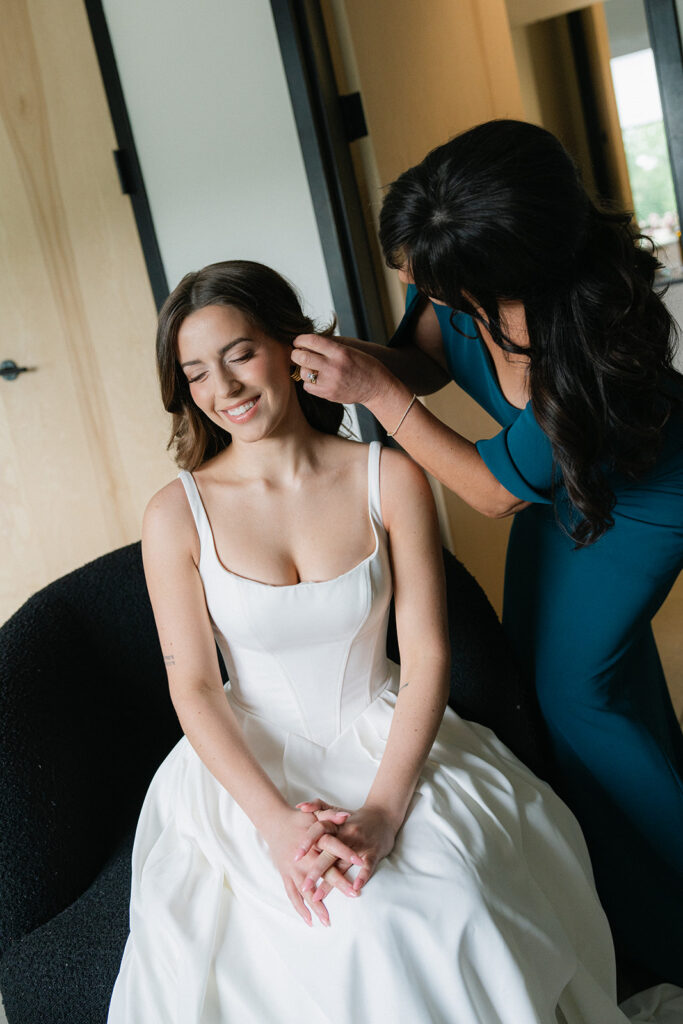 Bride sitting at the lumen house getting ready
