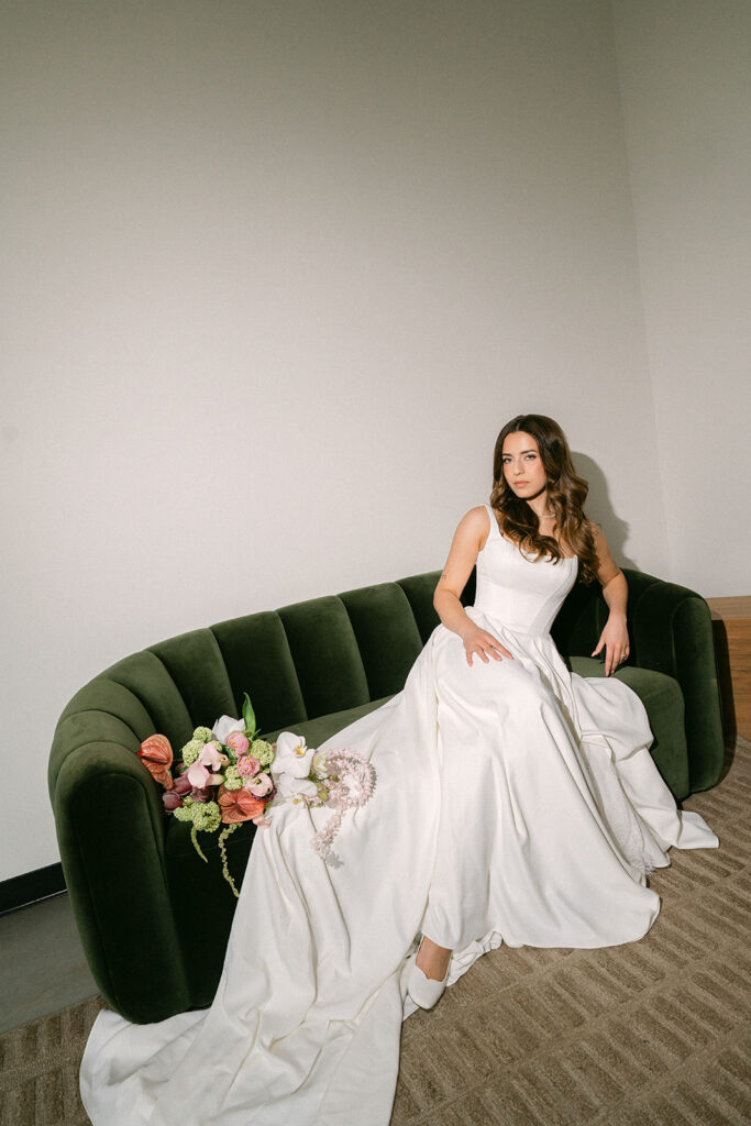 Bride on couch at The Lumen House wedding venue