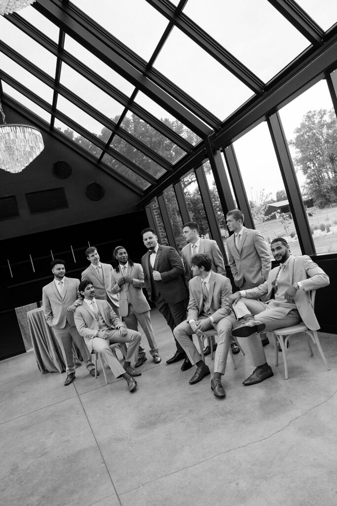 Editorial group posing with groomsmen